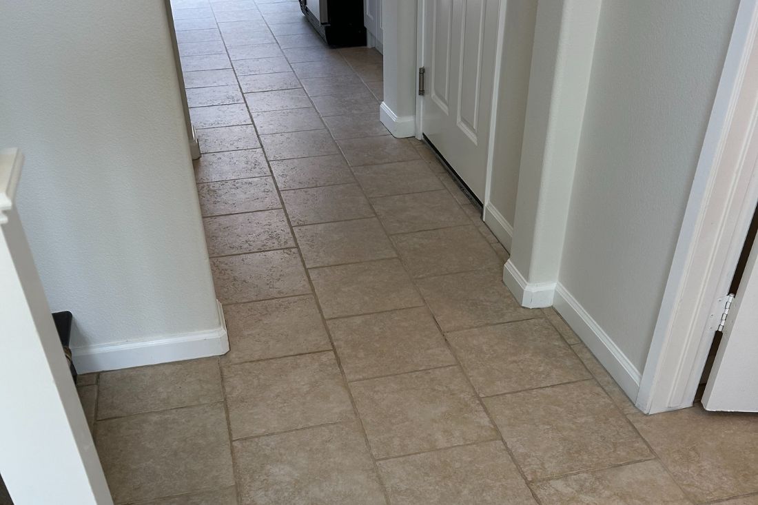 After StoneShine's ceramic tile cleaning and sealing service in Irvine. A hallway floor now features a spotless, sealed surface with a refreshed and polished appearance.