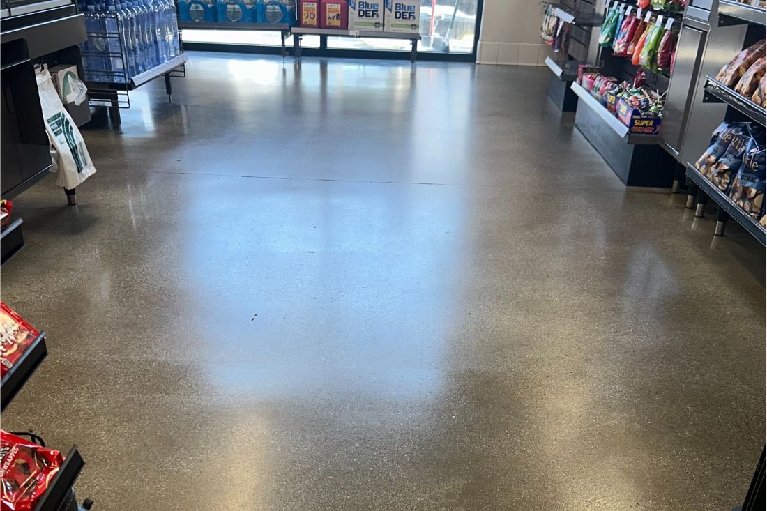 A polished concrete floor of a retail store after StoneShine's concrete polishing service.