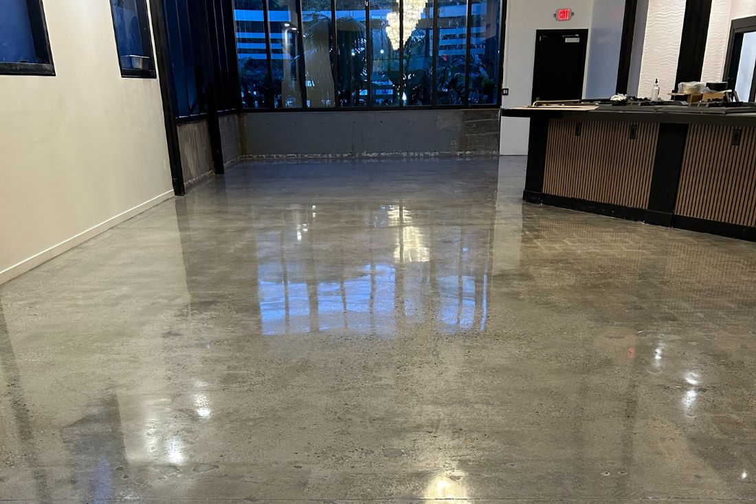 A polished concrete floor of a commercial space after StoneShine's concrete polishing service.
