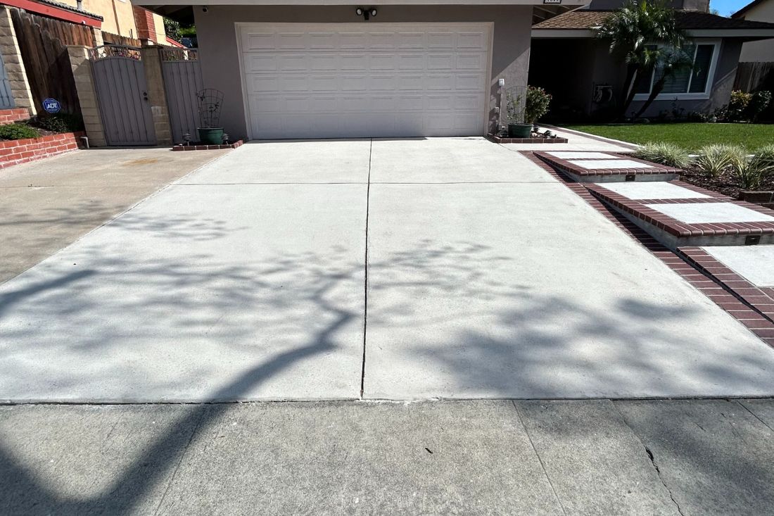 A clean and durable driveway after StoneShine's concrete grinding service in a residential property.