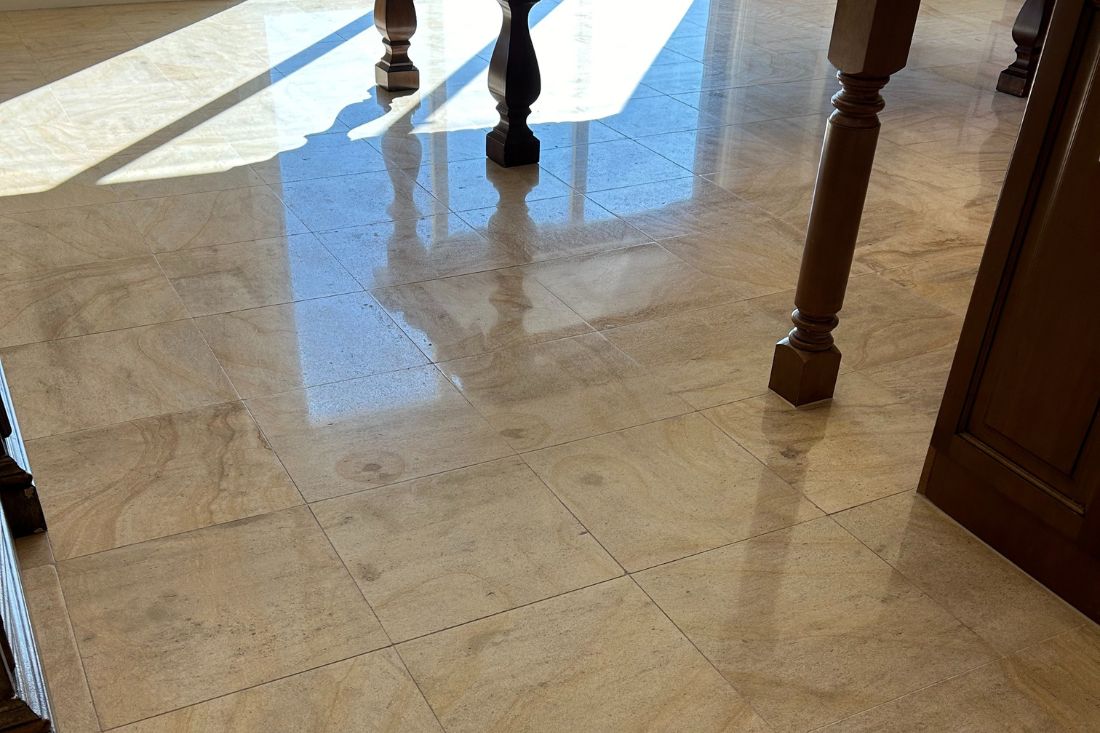 After StoneShine's limestone restoration service in Huntington Beach. The dining area floor features a gleaming, polished finish that enhances the stone's natural patterns and brings a bright, refreshed look to the space.