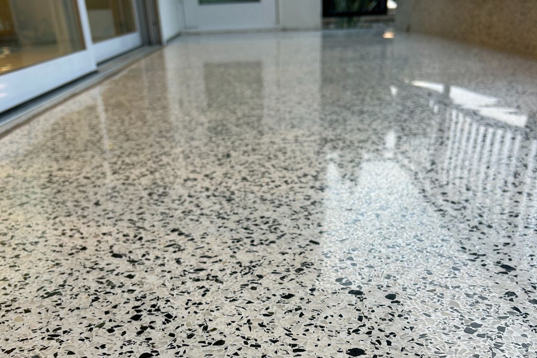 After photo of StoneShine's commercial terrazzo floor refinishing in Laguna Beach. The surface now features a high-gloss, polished finish with enhanced clarity and durability.