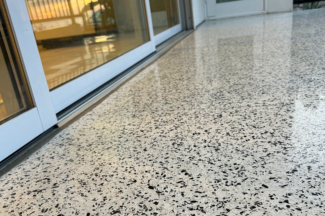 Polished result of StoneShine's commercial terrazzo floor refinishing in Laguna Beach. The restored surface showcases a clean, glossy finish with improved reflectivity and a refreshed modern look.