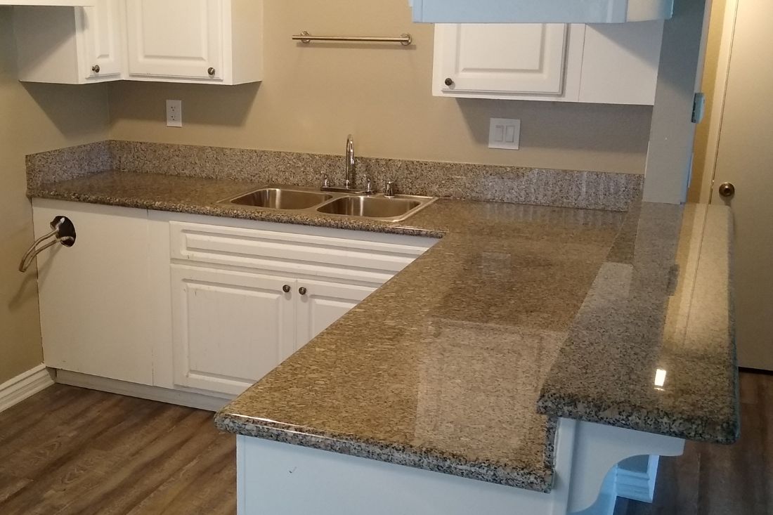 Polished granite kitchen countertop in Anaheim following StoneShine’s polishing service. The surface now features a glossy finish that enhances the overall brightness and elegance of the space.