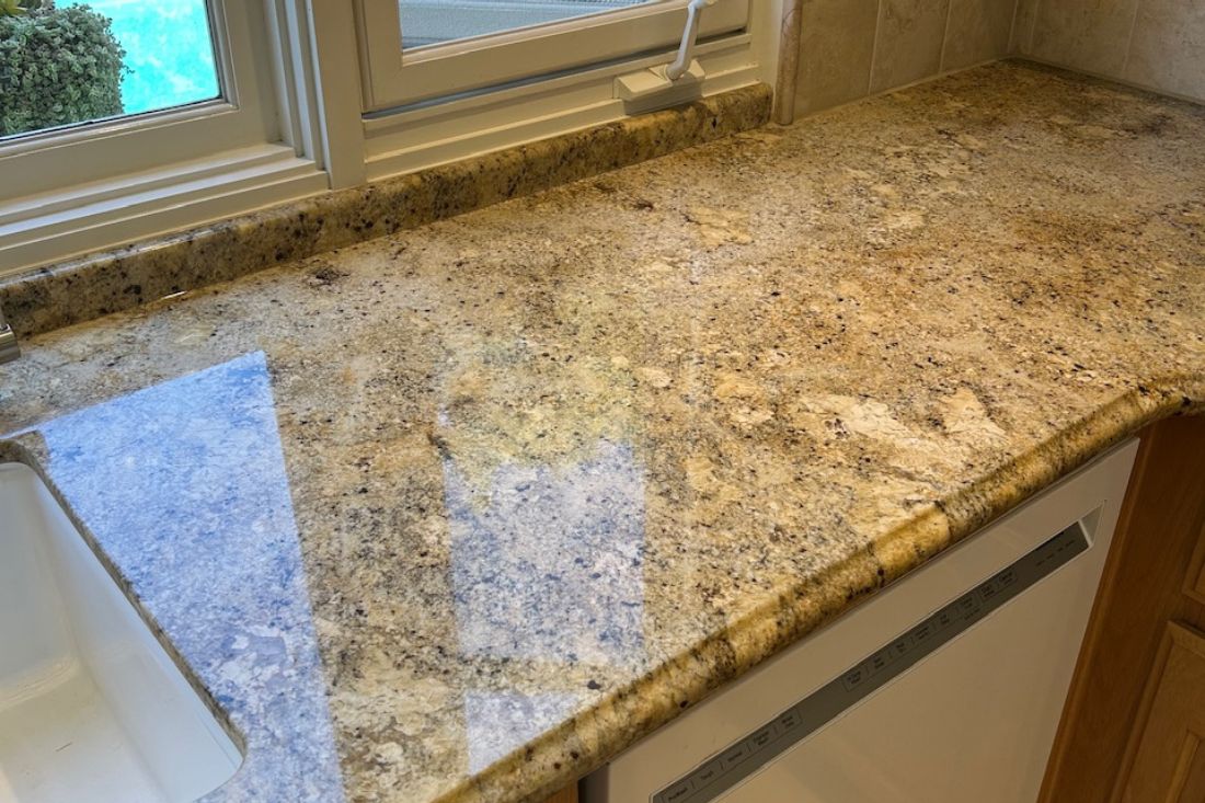 Granite countertop polishing by StoneShine in Huntington Beach. The kitchen counter now showcases a high-gloss finish that brings out the stone’s rich texture and enhances overall brightness.