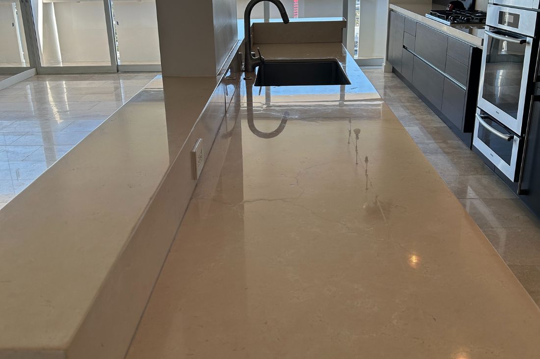 StoneShine's marble countertop polishing service in West Hollywood. The kitchen island surface now features a sleek, reflective finish that enhances the space’s modern elegance.