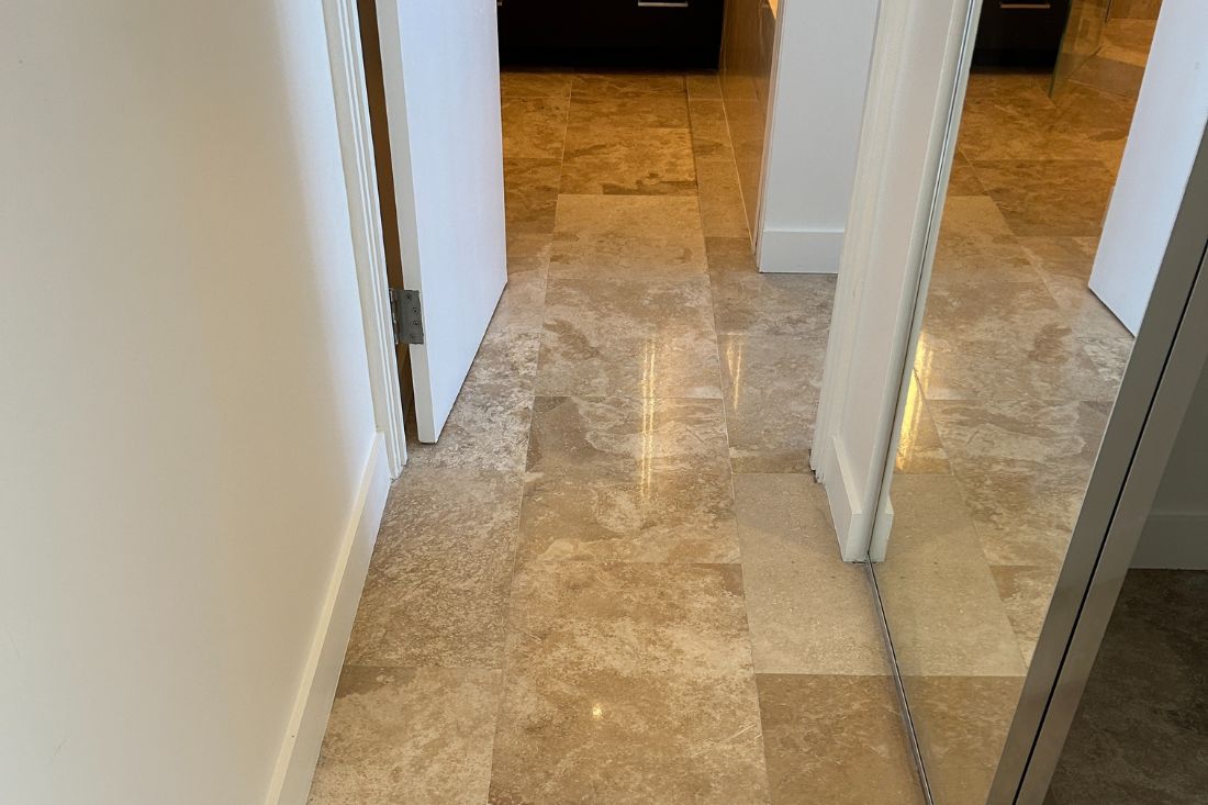 Marble floor polishing by StoneShine in West Hollywood. The hallway now features a clean, polished surface that enhances natural light and elevates the home's interior appeal.