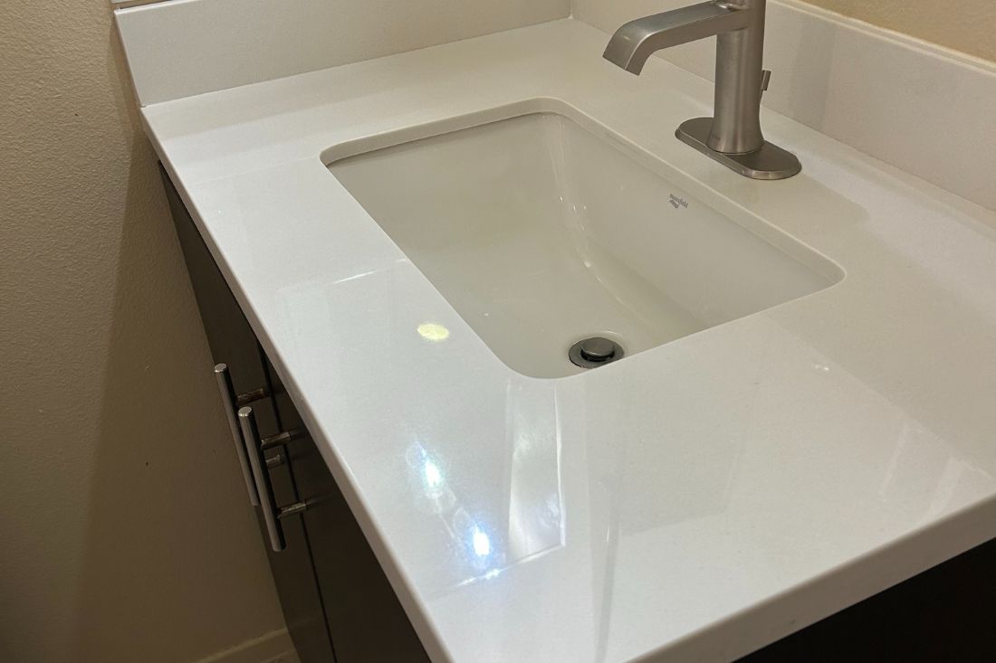 After photo of StoneShine's quartz polishing service in Los Angeles. A bathroom countertop features a smooth, glossy finish that enhances the surface's cleanliness and modern look.