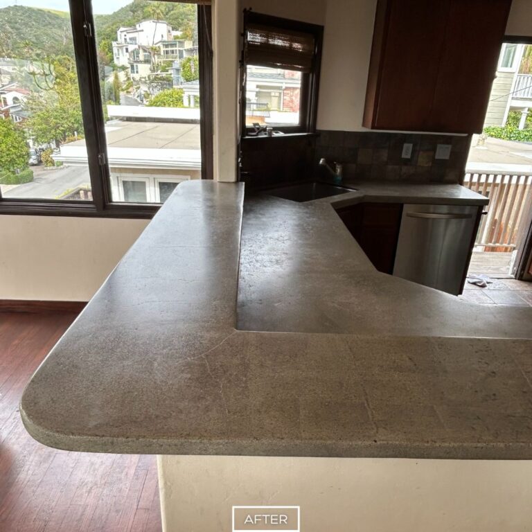 Concrete kitchen counters after grinding in Laguna Beach, revealing clean surface and rounded edge.