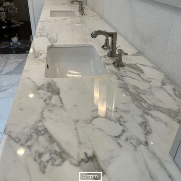Restored marble vanity with twin sinks and polished surface in Los Angeles bathroom