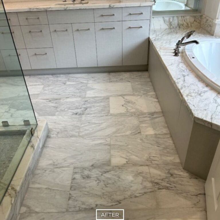 Restored marble floor and tub deck with matte finish in Los Angeles bathroom