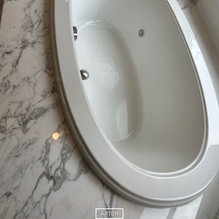 Restored marble tub surround with clean veining and smooth finish in Los Angeles bathroom