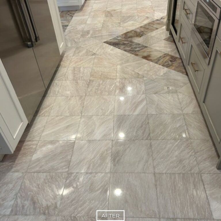 Polished marble floor reflecting lights after restoration in Beverly Hills kitchen