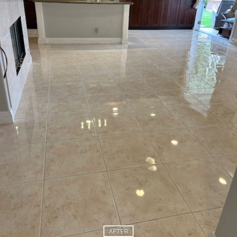 Refinished marble floor with mirror-like shine throughout open living space in Orange
