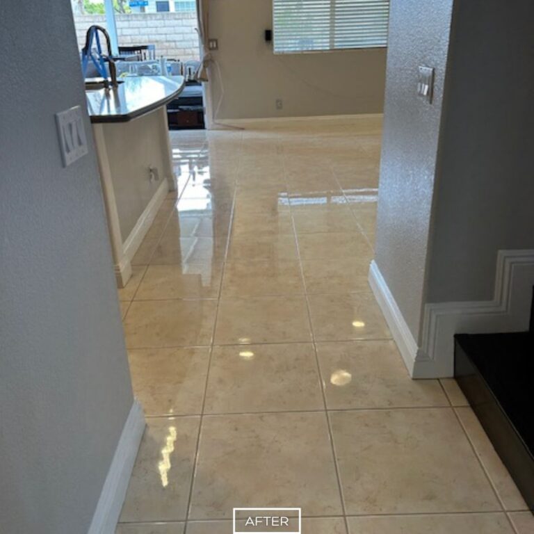 Restored marble hallway floor with glossy finish and clean grout lines in Orange home