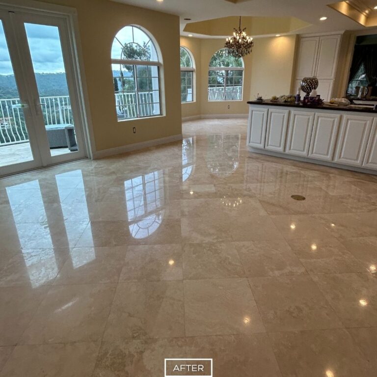 After travertine floor restoration in Diamond Bar featuring a bright, glossy surface with enhanced clarity and reflection across the spacious living area.
