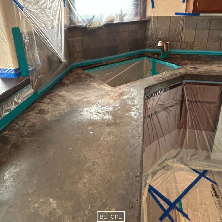 Rough concrete countertop before grinding in Laguna Beach kitchen restoration project.