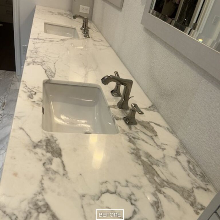 Etched and lightly stained marble bathroom countertop before restoration in Los Angeles