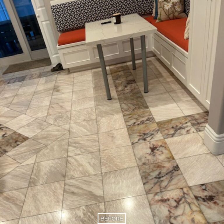 Unpolished marble floor around built-in seating before restoration in Beverly Hills