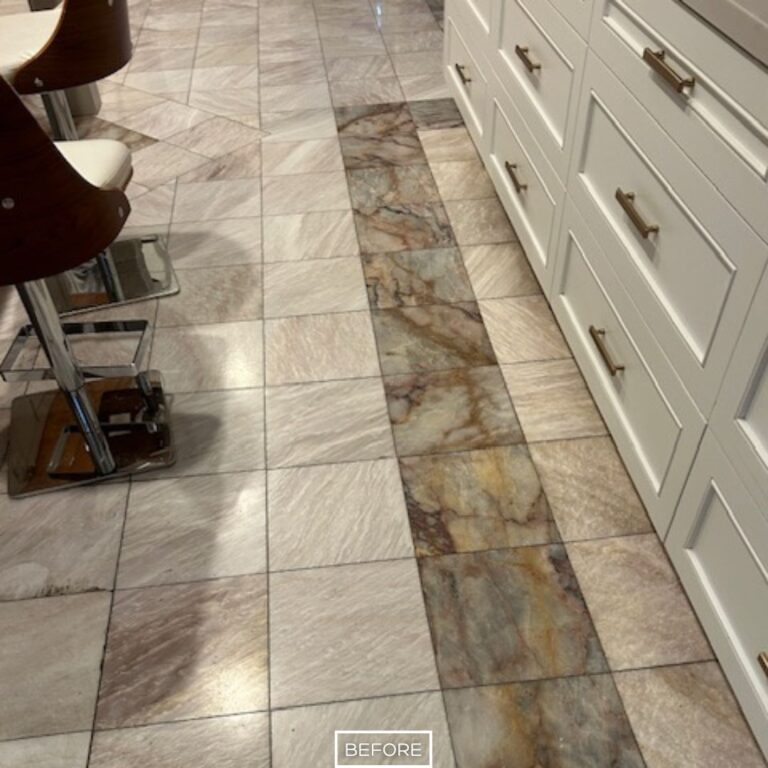Worn marble flooring near bar stools and cabinetry before restoration in Beverly Hills
