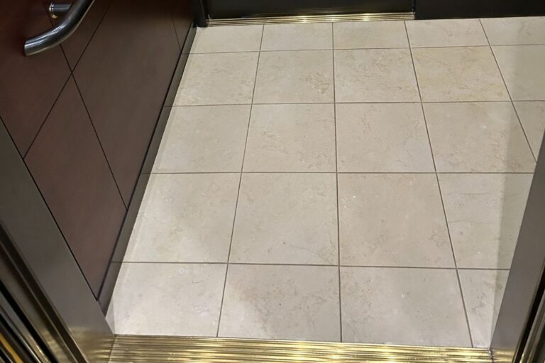 Appearance of crema marfil marble floor of the elevator after cleaning and sealing.