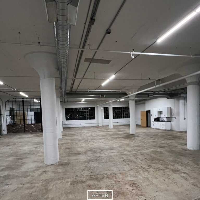Smooth concrete floor in Los Angeles after grinding, with uniform texture under modern lighting.