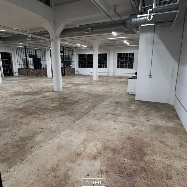 Even concrete floor in Los Angeles workspace after grinding, providing a durable and smooth surface ready for new flooring.
