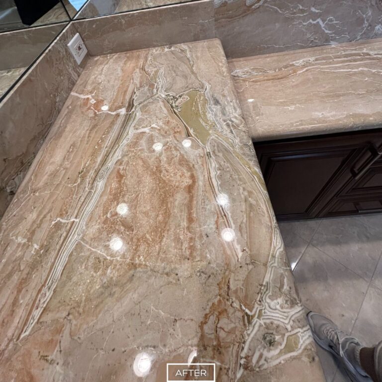 Polished marble vanity countertop in Los Angeles home after restoration, showcasing enhanced color and smooth reflective surface.