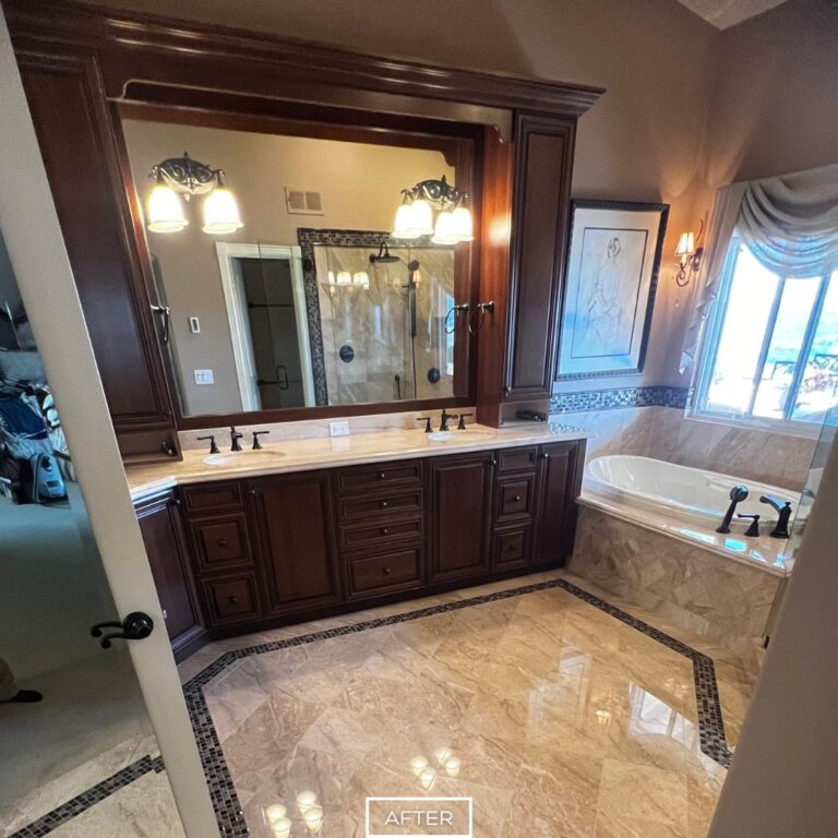 Restored marble bathroom in Yorba Linda with polished vanity, tub surround, and floor, reflecting light for a refreshed look.