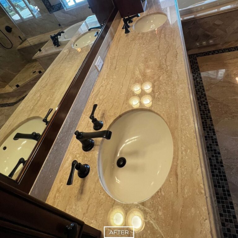 Polished marble vanity countertop in Yorba Linda bathroom after restoration, with smooth reflective surface and enhanced color.
