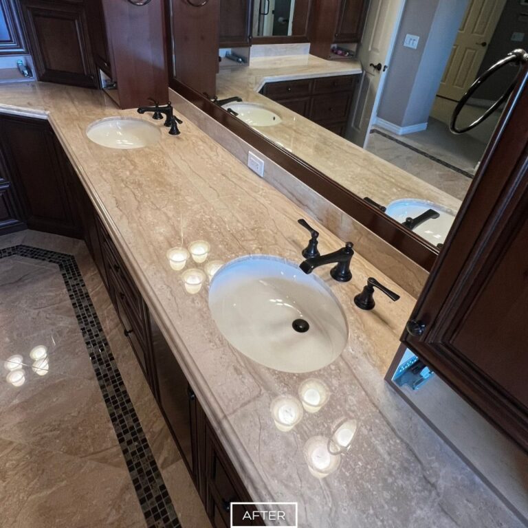 Marble vanity in Yorba Linda home after restoration, with glossy finish and seamless reflective surface across countertop.