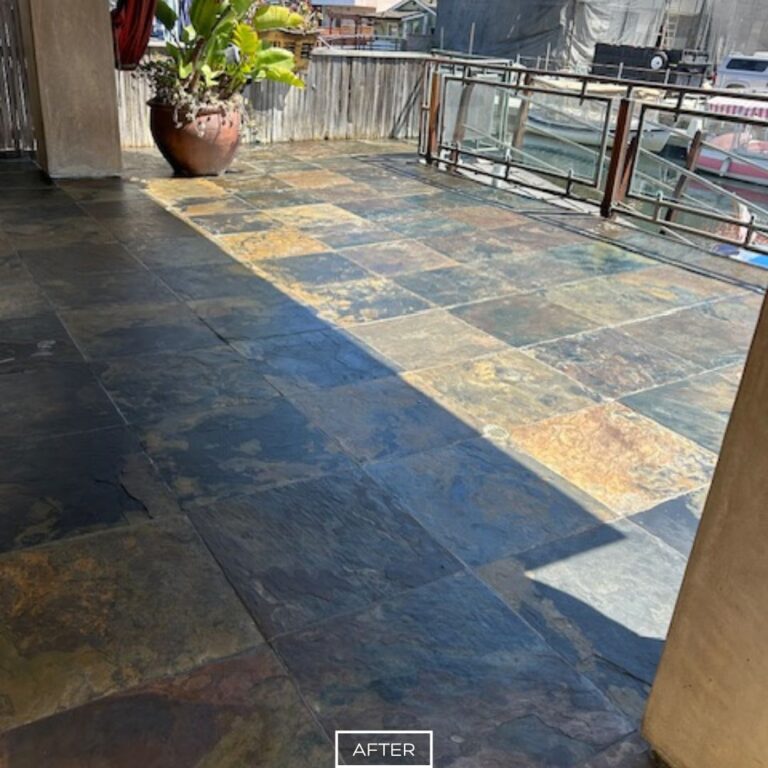 Slate floor restoration in Seal Beach outdoor space, displaying rich color contrast under natural light.