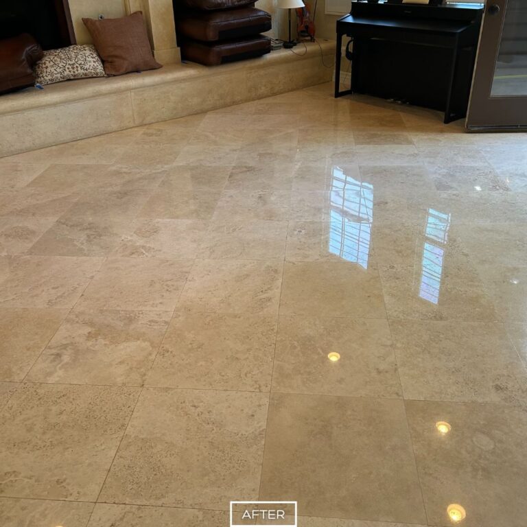 Shiny travertine tiles in San Clemente living room after professional restoration, enhancing durability and elegance.