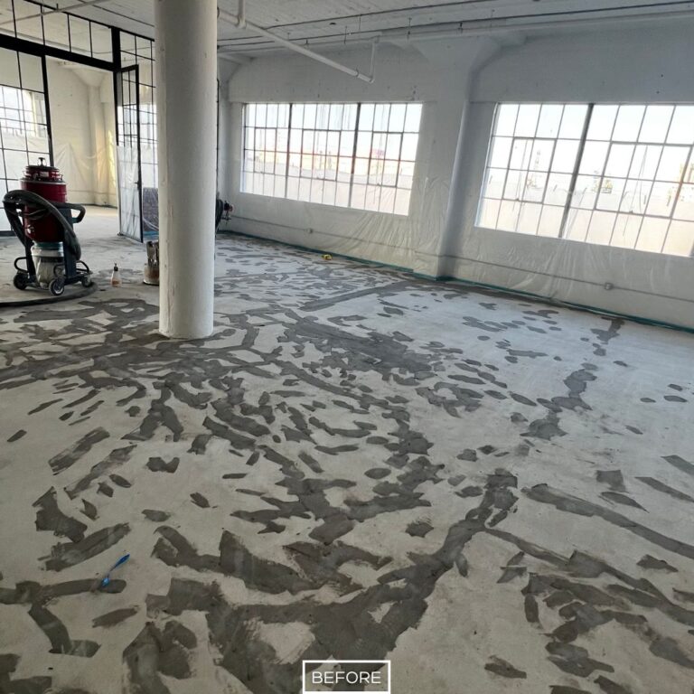 Concrete floor in Los Angeles marked with patchwork repairs before full grinding.