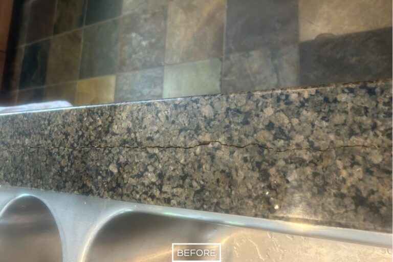 Close-up of a cracked granite countertop in a Rancho Cucamonga kitchen before StoneShine's repair service.