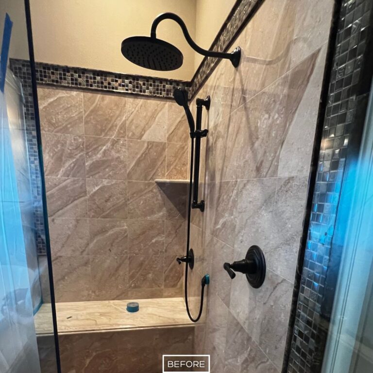 Marble shower walls in Yorba Linda bathroom before restoration, showing dull surface with buildup and lack of shine.