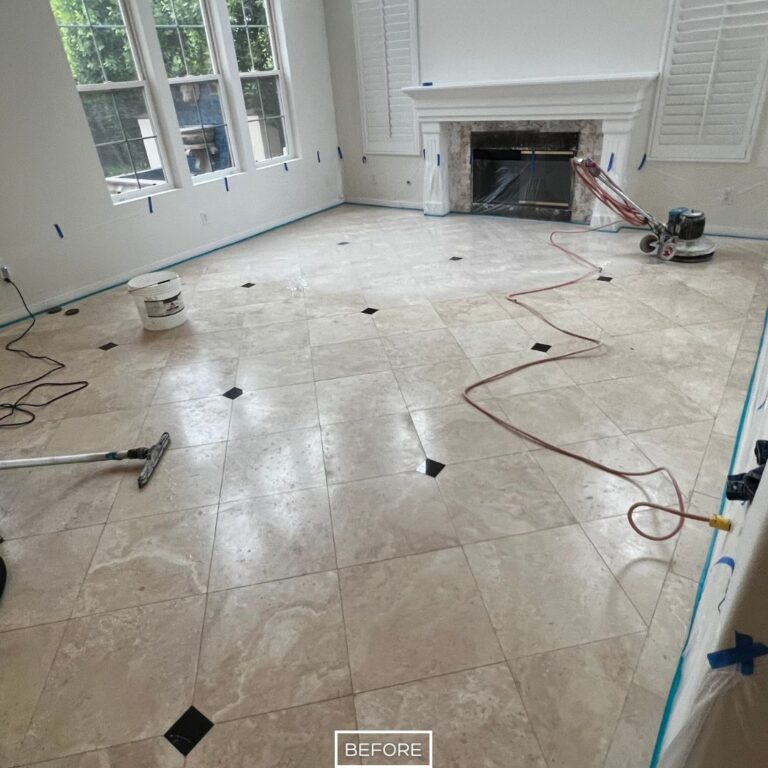 Worn travertine floor in Chino Hills living room before restoration, with visible dirt and faded appearance near fireplace.