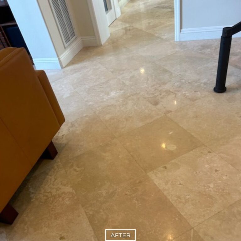 Clean and restored travertine tile floor near living room seating area