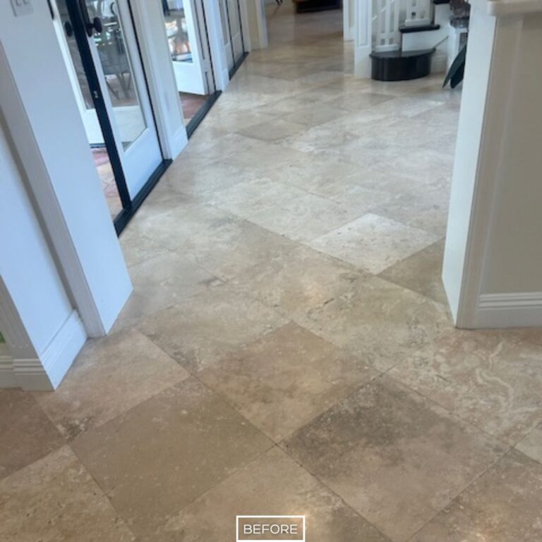 Dull and stained travertine hallway floor before restoration in Rancho Santa Margarita