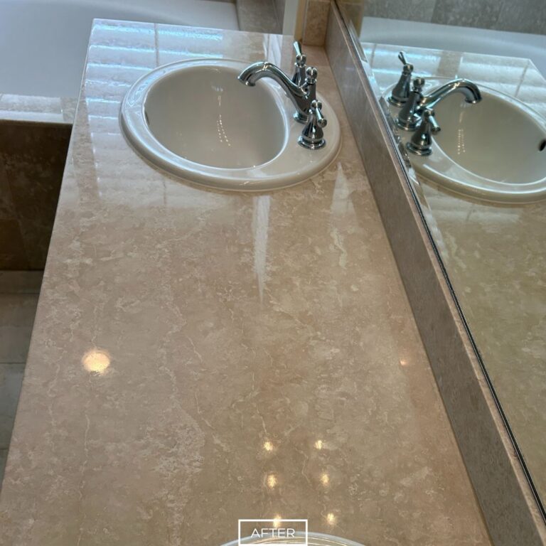 Restored marble countertop in Palm Springs bathroom with enhanced clarity and improved polish around the sink area.