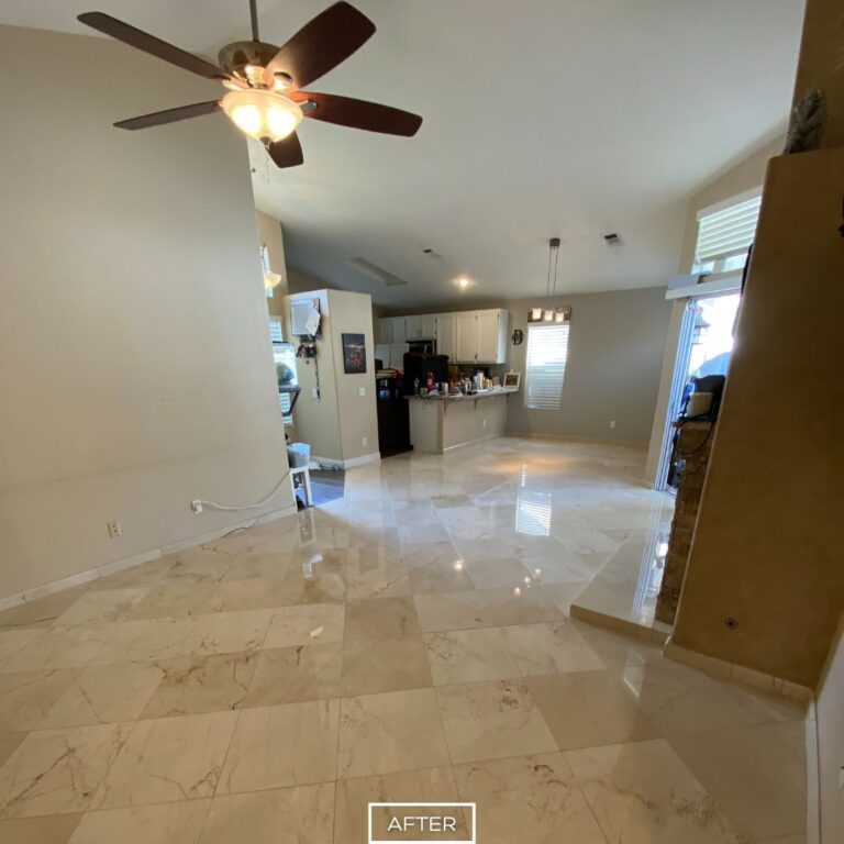 Living room marble floor in Los Angeles residence after professional restoration, showing a high-gloss finish and even tone.