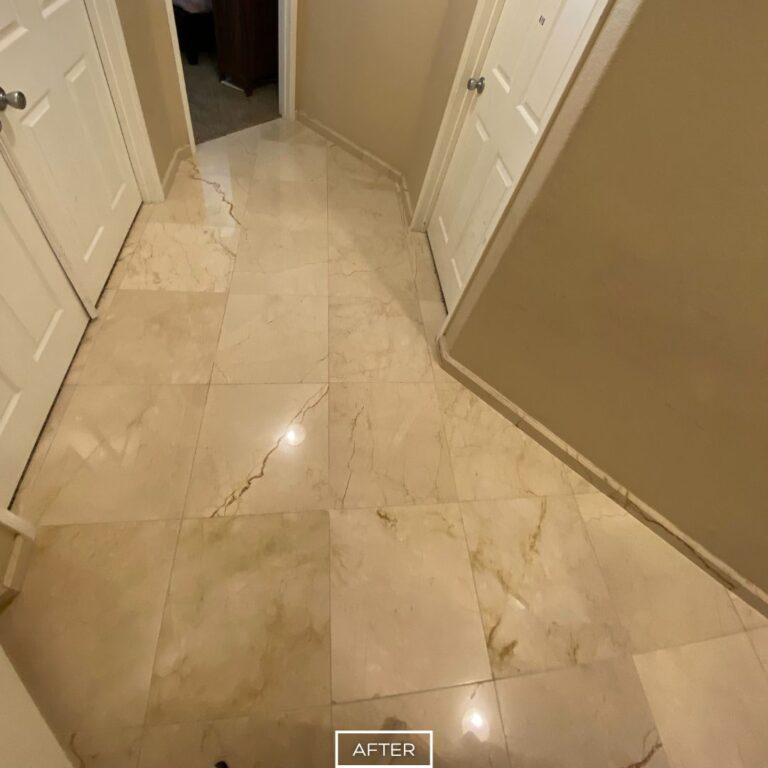 Polished marble hallway in Los Angeles home after restoration, with glossy reflective surface and renewed elegance.
