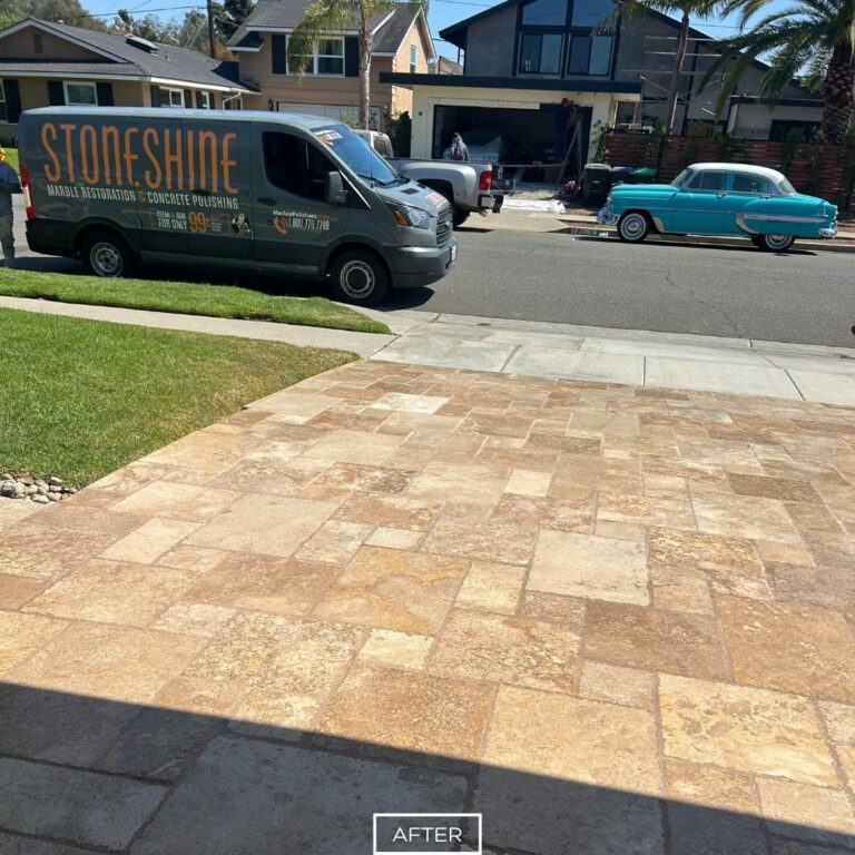 Restored travertine driveway in Huntington Beach displaying fresh color, clean lines, and lasting durability.