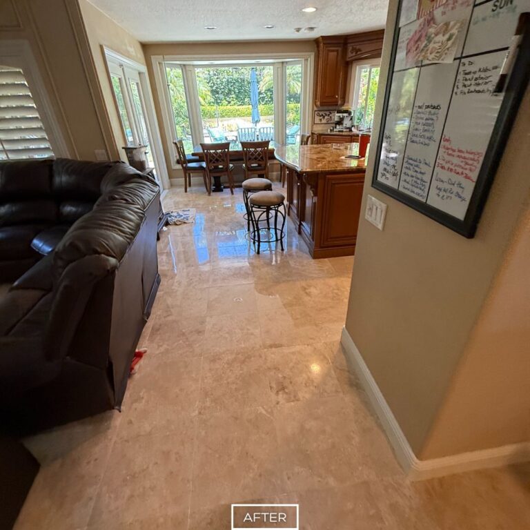 Restored travertine floor in Beverly Hills hallway leading to the kitchen, polished to a bright reflective finish.