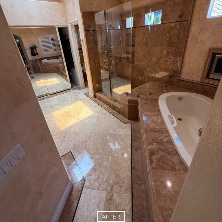 Polished travertine bathroom floor and shower area in Beverly Hills, restored to a brilliant shine with sealed protection.