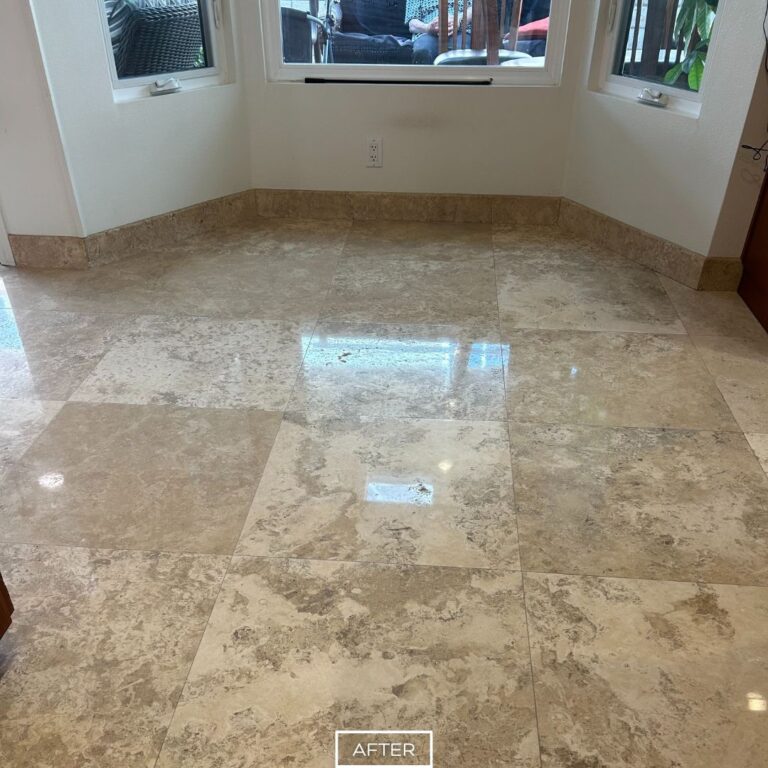 Restored travertine floor in West Hollywood dining nook with polished, glossy tiles and enhanced natural stone patterns.
