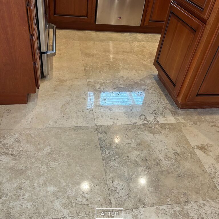 Restored travertine kitchen floor in West Hollywood with polished finish, highlighting natural tones and durability.