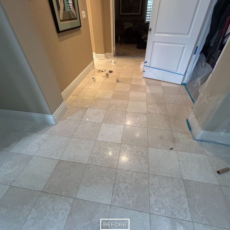 Before marble hallway floor restoration in Tustin showing dull surface with scratches and light staining.