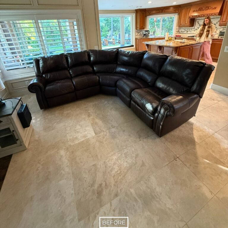 Travertine floor in a Beverly Hills living room before polishing, showing a flat, dull surface lacking shine and clarity.
