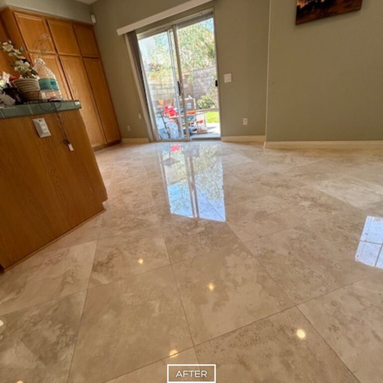 Restored travertine floor in Orange living room with smooth polished surface and sealed protection.